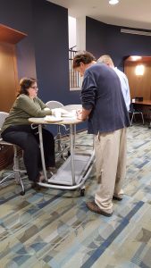 Dr. Alana Cain Scott, KATH Treasurer, at the registration table for KATH's 41st Annual Meeting